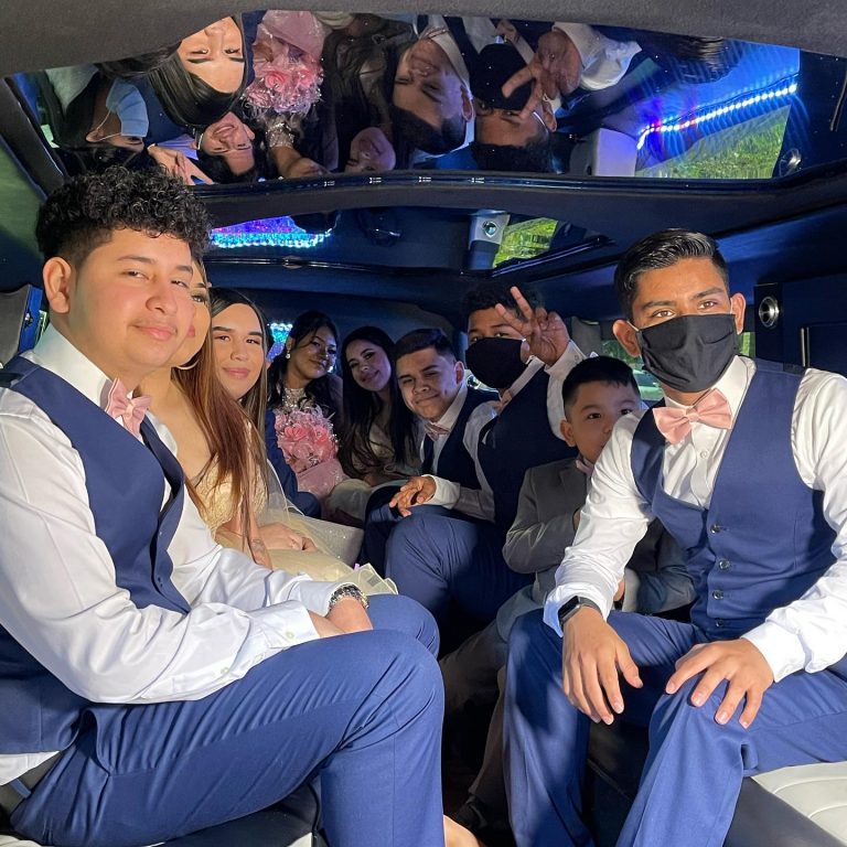 party posing inside of limo