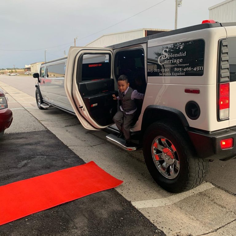 little boy getting out of limousine